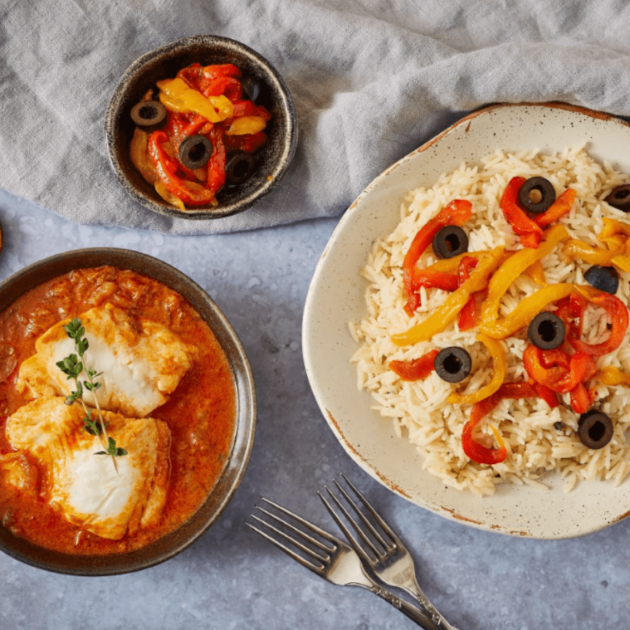 Fish yassa with butter rice, olives and roasted sweet peppers