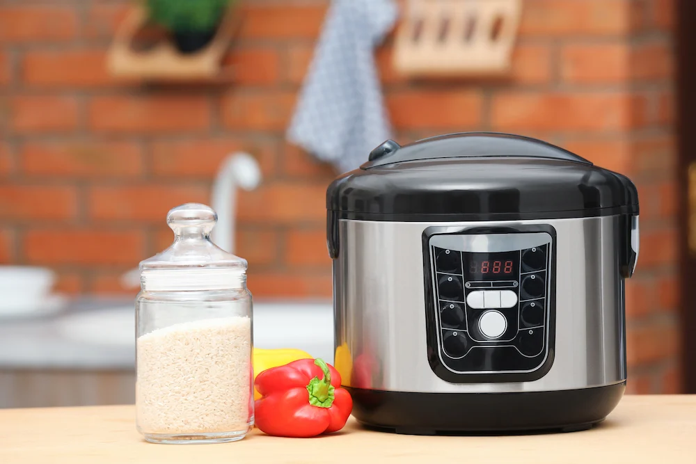 Air fryer on counter with rice